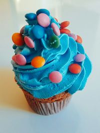 Close-up of multi colored cake on table