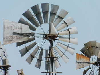 Low angle view of windmill against sky