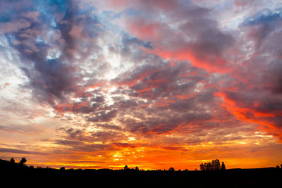 Low angle view of dramatic sky during sunset