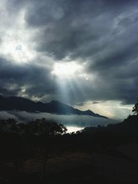Scenic view of landscape against cloudy sky