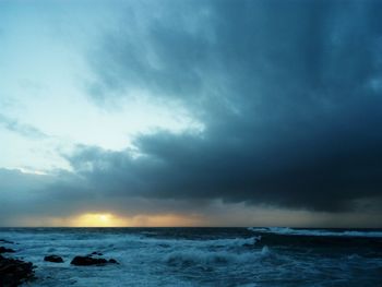 Scenic view of sea against dramatic sky