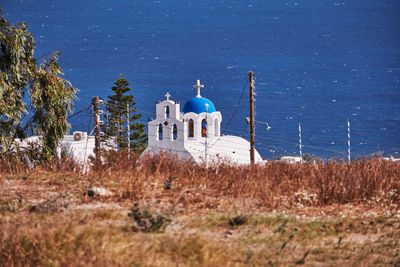 Small church with its blue dome - fira, santorini, greece - beautiful blue sky