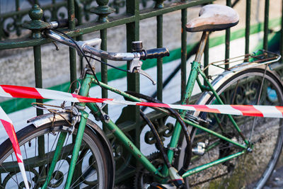 High angle view of bicycle parked by railing