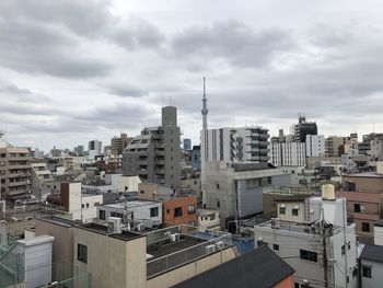High angle view of buildings in city against sky
