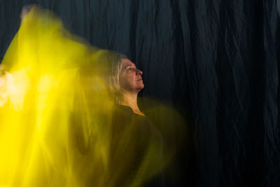 Time lapse view of woman moving a rag. long exposure, motion blur. 