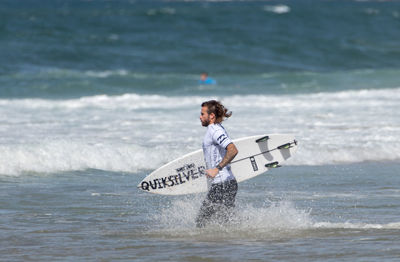 Man surfing in sea