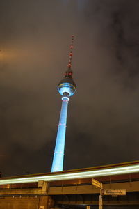 Low angle view of communications tower against sky