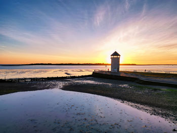 Sunset at the river colne and brightlingsea beach in essex, uk