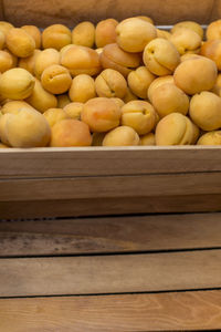 High angle view of fruits in crate at market stall