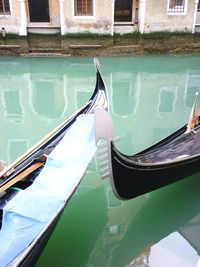 Close-up of gondolas in canal