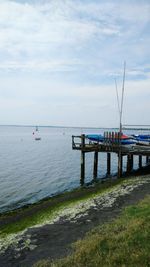 Scenic view of sea against cloudy sky