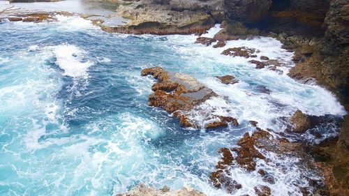 Waves splashing on rocks