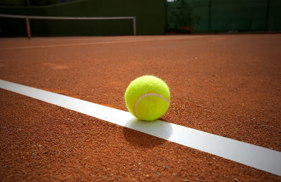 Close-up of ball on tennis court