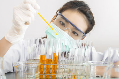 Scientist working at table in laboratory