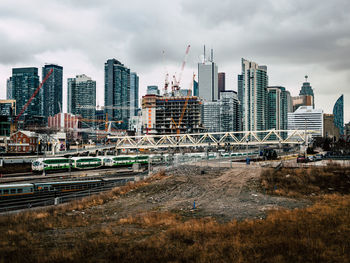 Modern buildings in city against sky