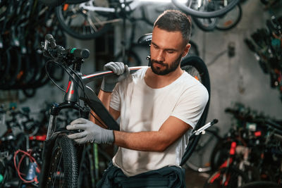 Side view of man riding bicycle