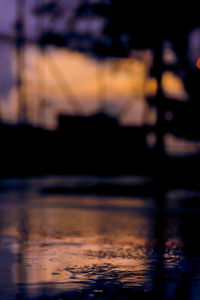 Defocused image of lake against sky at night