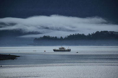 Fishing boat on river at dusk