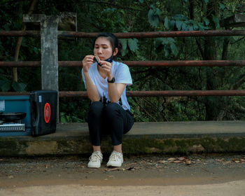 Portrait of teenage girl sitting outdoors