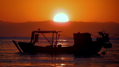 Scenic view of sea at sunset
