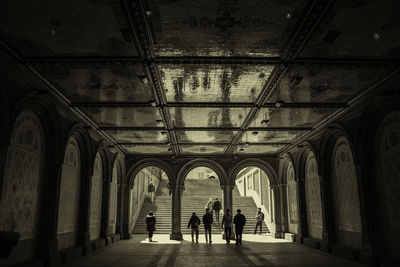 Men walking in corridor