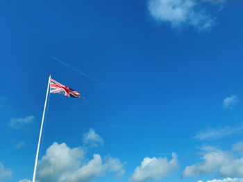 Low angle view of flag against sky