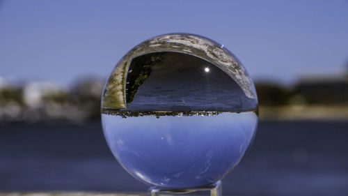 Close-up of crystal against clear sky