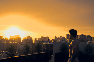 High angle view of city at sunset