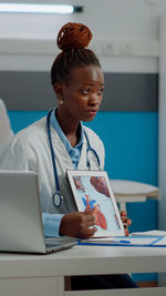 Woman using laptop on table