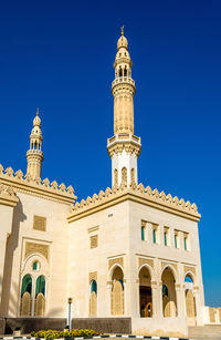 Low angle view of building against blue sky