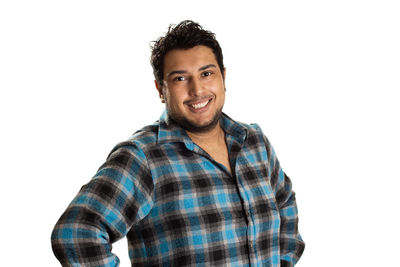 Portrait of smiling young man against white background