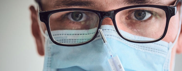 Close-up portrait of man wearing eyeglasses