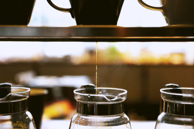 Close-up of coffee pouring in jar