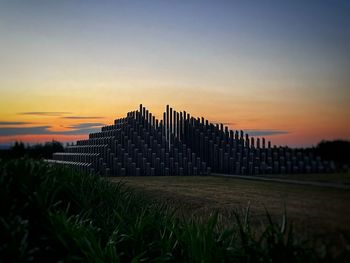 Scenic view of field against sky during sunset