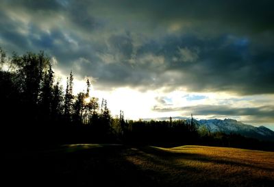 Scenic view of landscape against cloudy sky