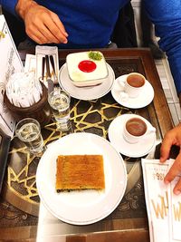 High angle view of people served on table