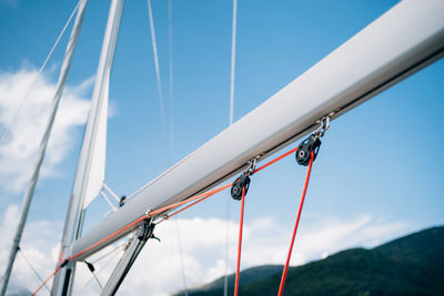 Low angle view of sailboat against blue sky