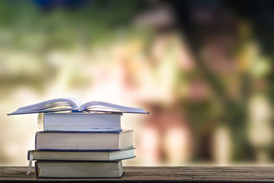 Close-up of stacked books on table