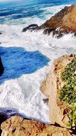 Waves splashing on rocks