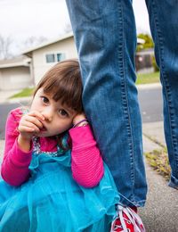 Portrait of girl with father on road