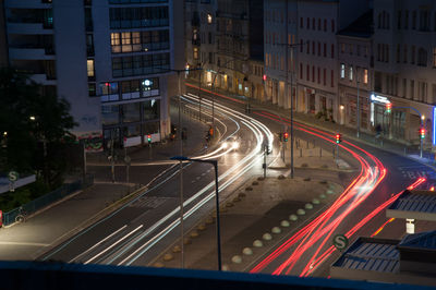 Light trails on road in city at night