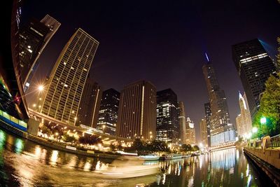 Low angle view of illuminated city at night
