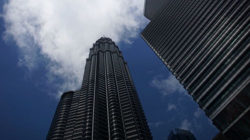 Low angle view of modern buildings against sky