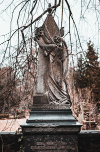 Low angle view of statue against sky