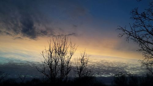 Scenic view of landscape against sky at sunset