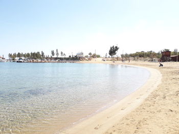 Scenic view of beach against clear sky