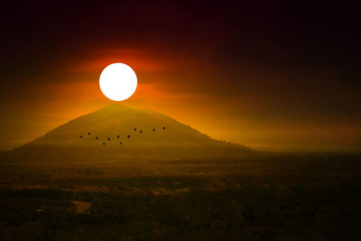 Scenic view of mountains against sky during sunset