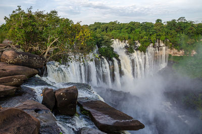 Scenic view of kalandula falls against sky, angola, africa