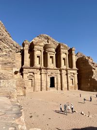 An epic view of the monastery in petra, jordan on a sunny day.