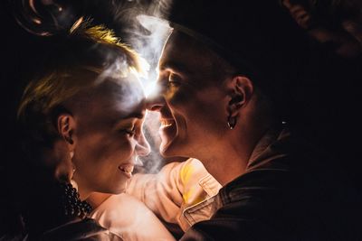 Portrait of couple friends at night